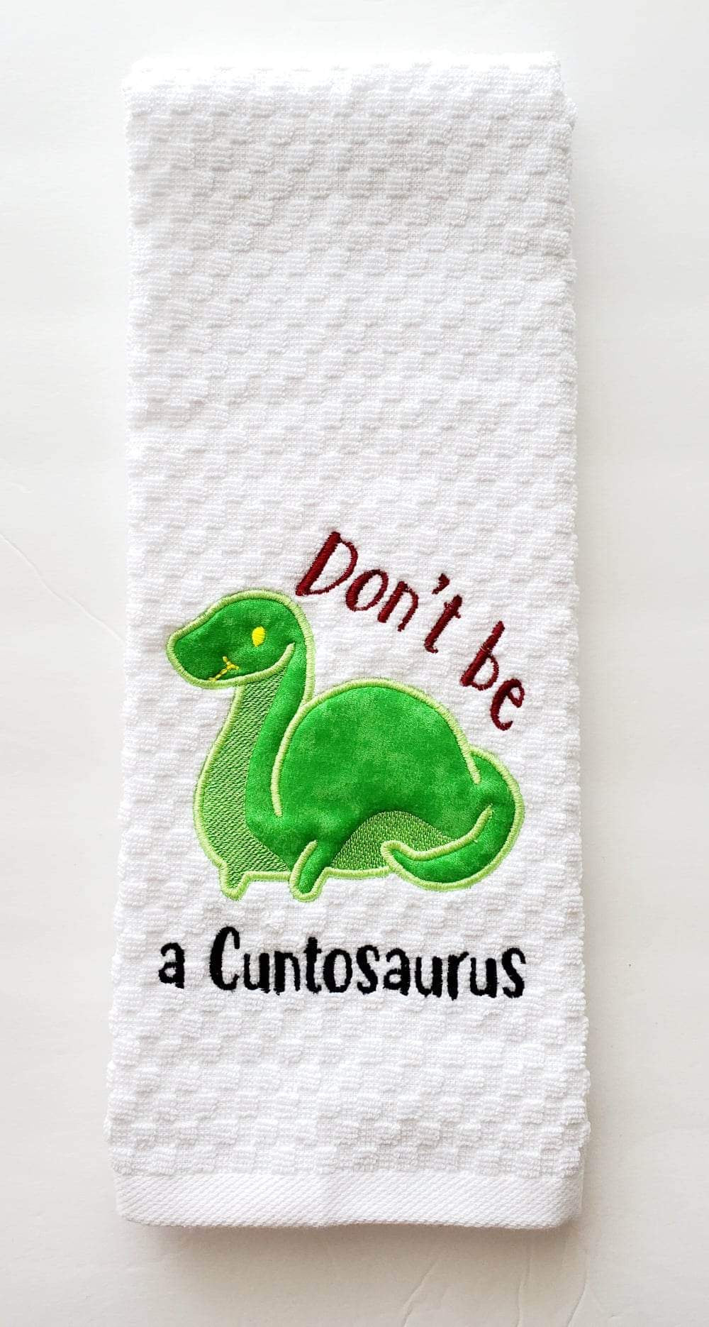 Don’t be a Cuntosaurus kitchen towel